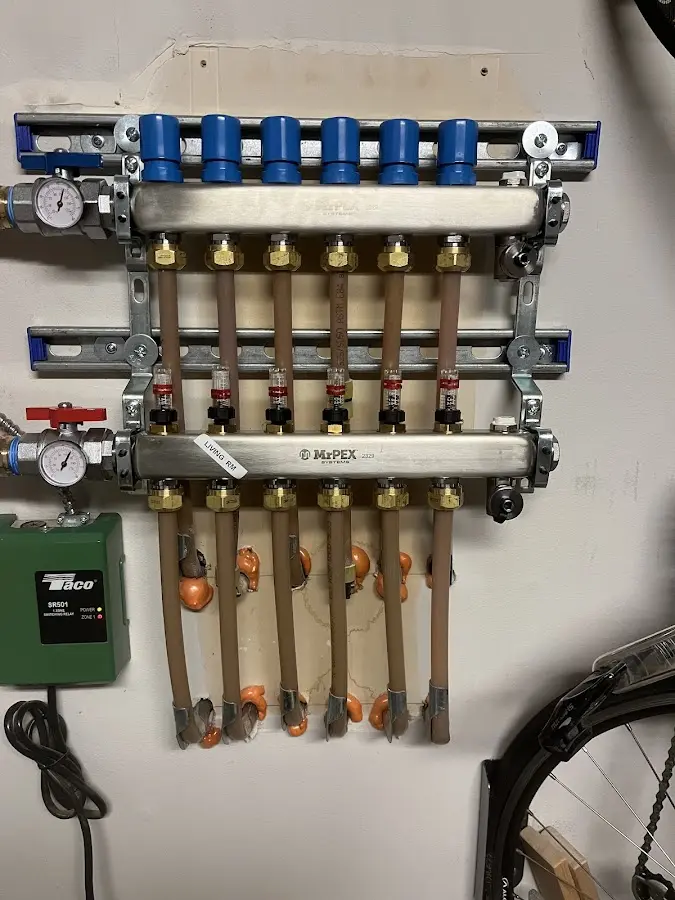 Plumber performing Water Heater Repair at a residential property in Cherryvale